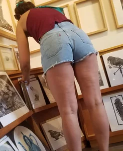 Laughing girl in shorts, legs and thick peach