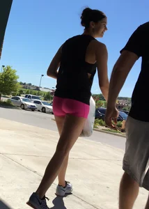 Sexy girl with a nice ass in tight pink spandex shorts