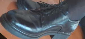 Closeups of college girls' legs and feet in pantyhose and various shoes (including high heels) in classrooms
