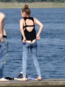 Girl on the water in black thong bikini with a nice ass