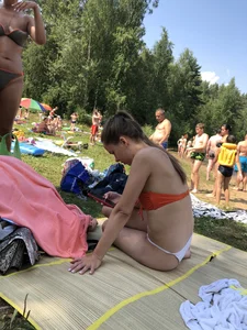 Sexy Girl in Swimsuit Sitting on a Beach With Her Phone Creepshots Gallery