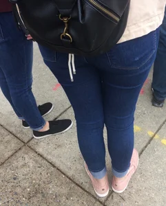 2 nice asses in tight jeans standing around
