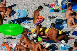 FKK Nudists playing in the water with floater