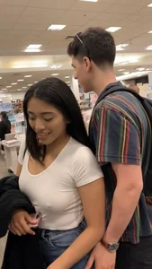 Pretty babe in tight jeans showing nipples in book store w bf (Not OC)(Face shot)