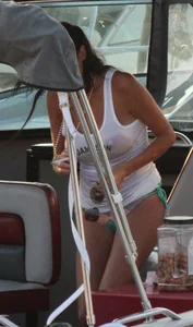 Bikini babe on a boat with a wet see through white shirt showing her tits