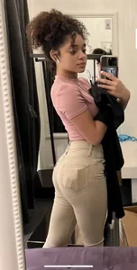 Cute girl with curly hair sexy mirror selfies