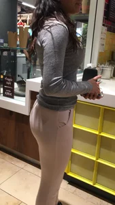Sexy brunette in pink leggings getting food with a great ass and beautiful face
