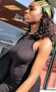 Sexy braless ebony babe in tight skirt with pokies