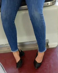 Hot candid milf in tight blue jeans sitting in a public bus