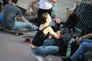 Hot brunette skateboarder in tight jeans and with hard nipples