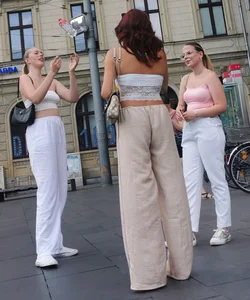 Long blonde braless in a white outfit (many pictures)