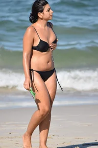 Thick mature brunette bikini lady on the beach with a nice body
