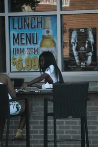Sexy ebony Tilted Kilt employee in her uniform