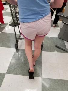 Nice blonde ass in athletic shorts while shopping