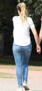 Blonde chick walking with her boyfriend in tight jeans