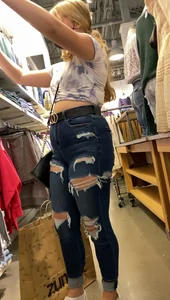 Two blonde teens shopping