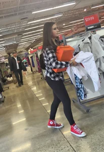 Cute Girl in Yoga Pants Bending Over at the Store