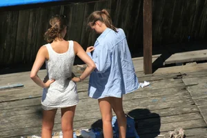 Two teens stripping and going topless to tan