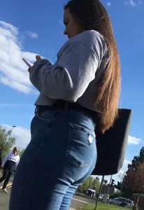 Long haired beauty teen with a tight ass in jeans