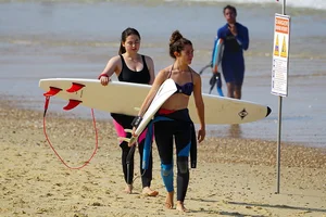 Candid surfer babes on the beach and in bikinis