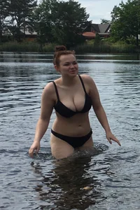 Big boobed babe at the lake in a black thong with blonde friend