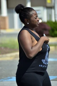 Chubby black lady with big tits and no bra lets it slip