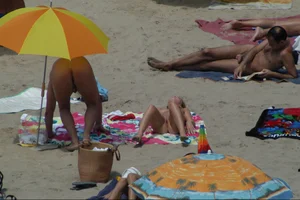 Girls on a nude beach in Sitges, Spain