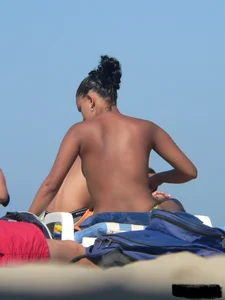 Hot ass topless beach girl with great tits lets her little brother oil up her ass in thong bikini