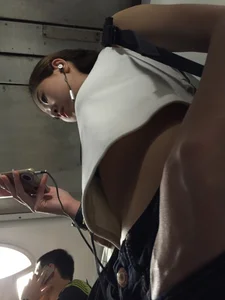Sexy Asian showing bra under shirt and a little cleavage