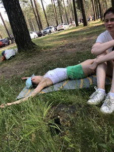 Barefoot Candid Girl in Mini Shorts Lying on the Grass in Nature Park With Spread Legs - Her Panties Sticking Out