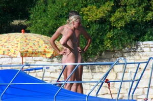 Sexy and skinny blonde nudist milf on the beach