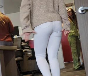 Gorgeous slim blonde in white jeans