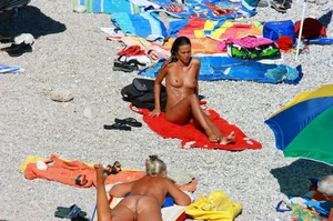 Ula FKK Sexy brunette on a nude beach topless, bottomless and with blue thong