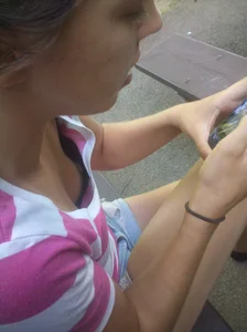 Girl Sitting on a Street Bench