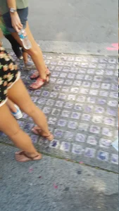 Girl in shorts and sandals on the street busted
