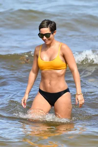 Frankie Bridge nip slips in a bikini on the beach