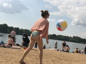 A Hot Candid Milf in a Swimsuit Playing Ball at the Beach Creepshots Gallery