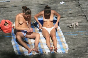 Two teens stripping and going topless to tan
