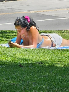 Suntanning Season is back! Black Thong Girl Tanning!