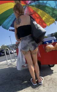 Milf with cheeks out and “Wild” tattoo