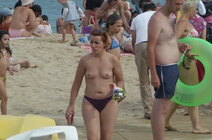 Topless girls on a beach in Barcelona