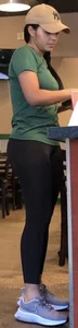 Latina in Nike leggings at the wing shop