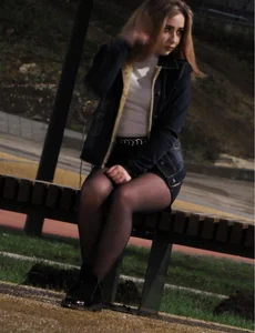 Hot Girl with Hot Legs in Black Pantyhose Sitting on the Bus Stop