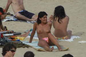 Topless girls on a beach in Barcelona