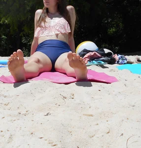 Barefoot Girl in Underwear Sitting on the Beach With Spread Legs