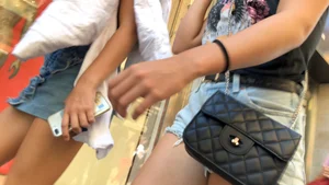 Shorts girl walking with nice legs and some cheeks showing