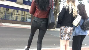 Chav brunette with a nice ass and vpl in tight black leather pants