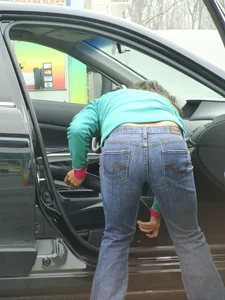 Girls cleaning their cars in jeans and pants