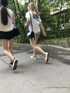 Couple of candid teens walking down the street
