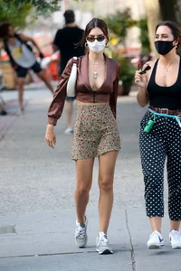 Emily Ratajkowski in mini skirt out for a walk with a friend in New York